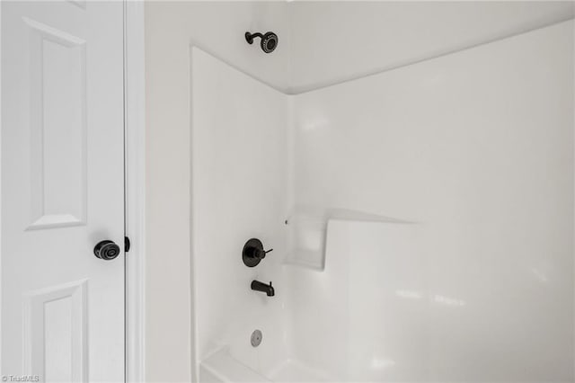 interior details featuring shower / bathing tub combination