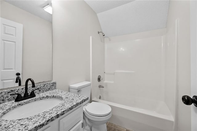 full bathroom featuring vanity, a textured ceiling, shower / bath combination, and toilet