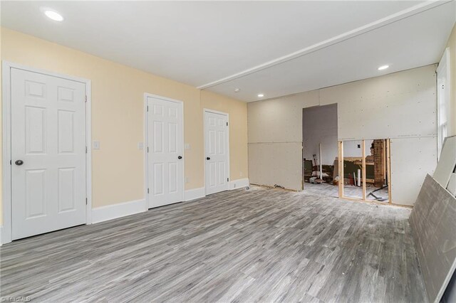 2515 N Patterson Ave, Winston-Salem, NC 27105 - unfurnished living room with wood finished floors, recessed lighting, and baseboards