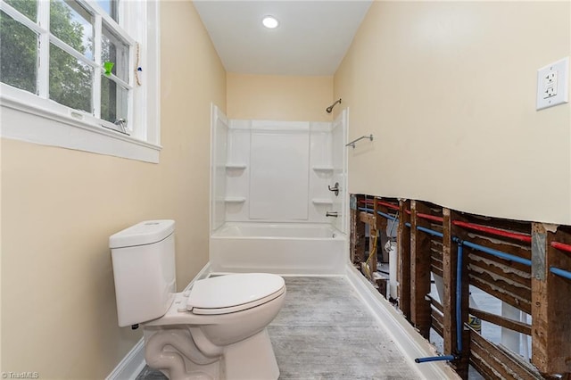 2515 N Patterson Ave, Winston-Salem, NC 27105 - bathroom featuring toilet, shower / bathtub combination, and baseboards