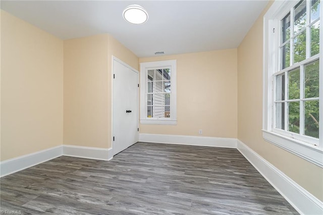 2515 N Patterson Ave, Winston-Salem, NC 27105 - unfurnished room with healthy amount of natural light, baseboards, and wood finished floors