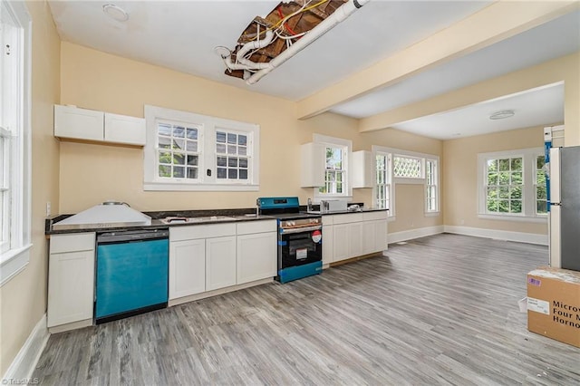 2515 N Patterson Ave, Winston-Salem, NC 27105 - kitchen featuring dishwashing machine, stainless steel range with electric cooktop, dark countertops, light wood finished floors, and freestanding refrigerator