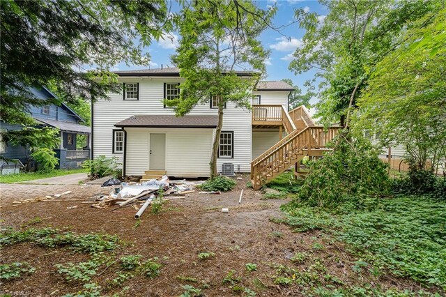 2515 N Patterson Ave, Winston-Salem, NC 27105 - back of property with central AC unit, stairway, a wooden deck, and entry steps