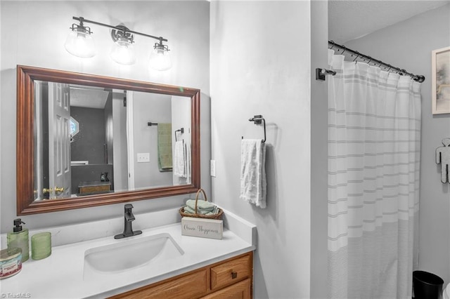 bathroom with a shower with curtain and vanity