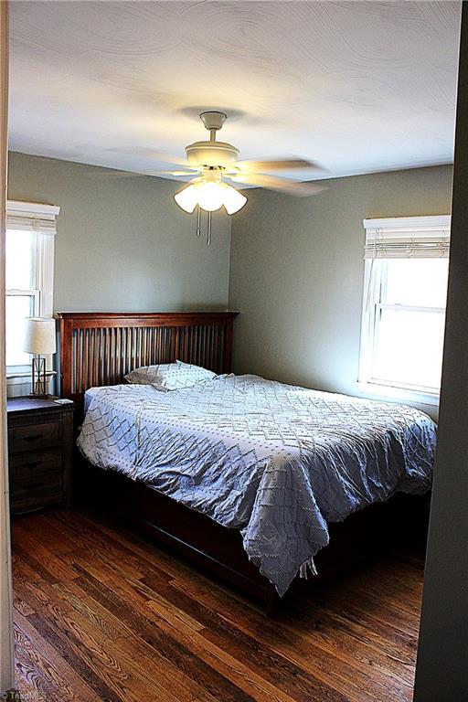 177 Duke Rd, Mount Airy, NC 27030 - bedroom featuring dark wood finished floors and a ceiling fan