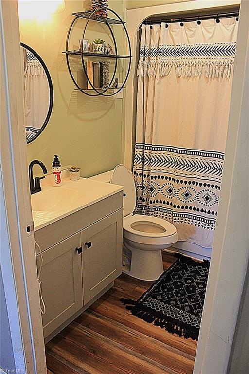 177 Duke Rd, Mount Airy, NC 27030 - bathroom with toilet, wood finished floors, and vanity