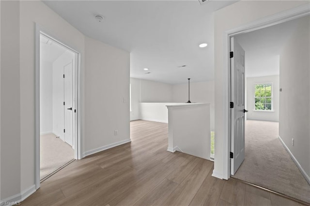 4908 Peppercorn Ln, Greensboro, NC 27406 - corridor featuring wood finished floors, an upstairs landing, and recessed lighting