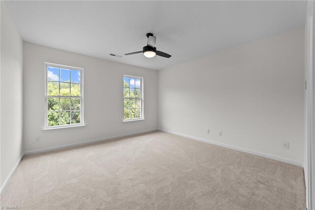 4908 Peppercorn Ln, Greensboro, NC 27406 - unfurnished room featuring carpet and ceiling fan