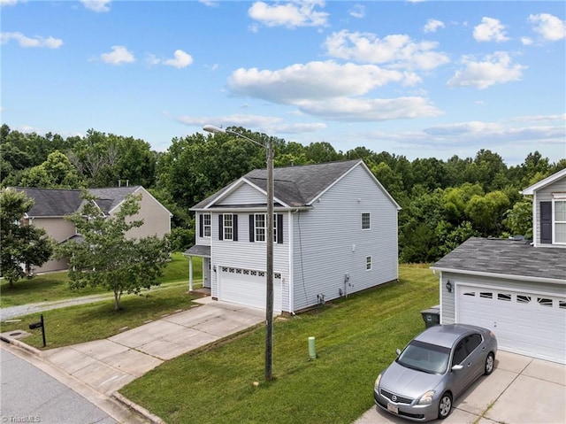 4908 Peppercorn Ln, Greensboro, NC 27406 - view of side of home featuring concrete driveway, a yard, and a shingled roof
