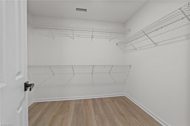 4908 Peppercorn Ln, Greensboro, NC 27406 - spacious closet with wood finished floors