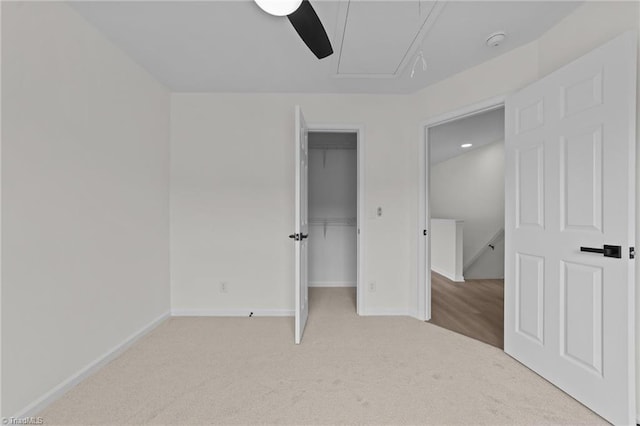 4908 Peppercorn Ln, Greensboro, NC 27406 - unfurnished bedroom with attic access, carpet, ceiling fan, and a closet