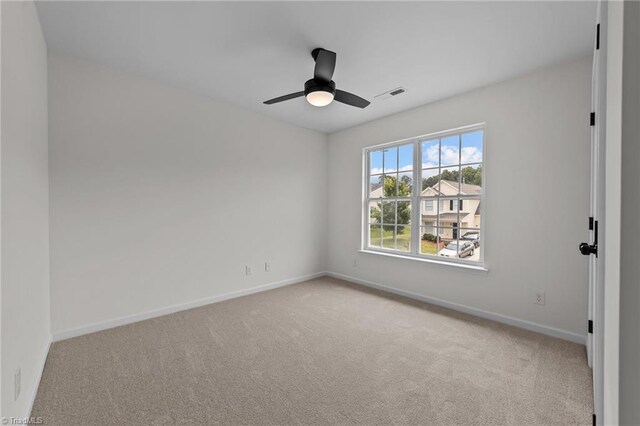 4908 Peppercorn Ln, Greensboro, NC 27406 - empty room featuring carpet flooring and a ceiling fan
