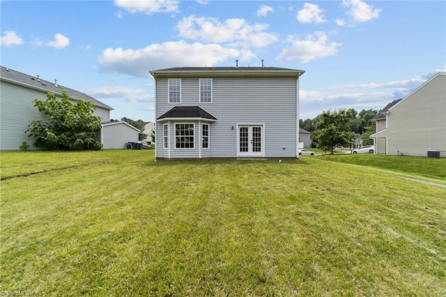 4908 Peppercorn Ln, Greensboro, NC 27406 - back of property with a yard and french doors