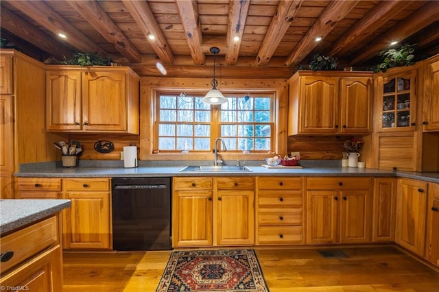 kitchen featuring sink, dishwasher, light hardwood / wood-style flooring, and beam ceiling