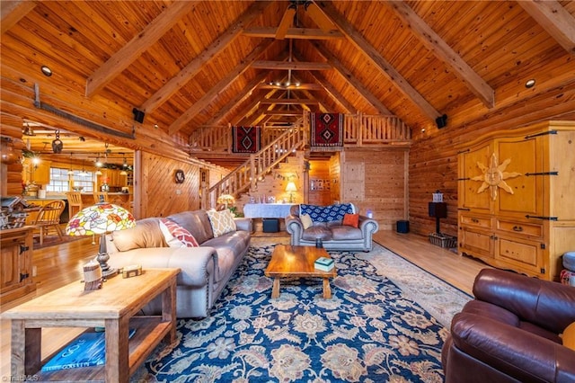 living room with wood ceiling, hardwood / wood-style flooring, beamed ceiling, and wood walls