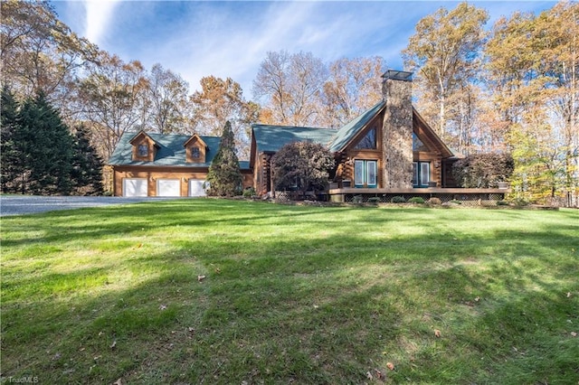 log-style house featuring a garage and a front lawn