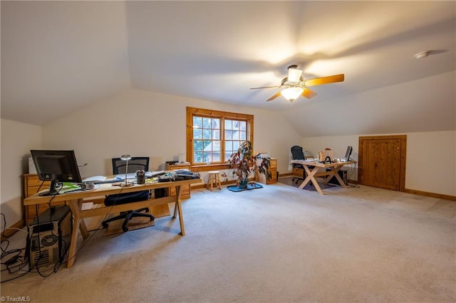 carpeted home office featuring ceiling fan and lofted ceiling