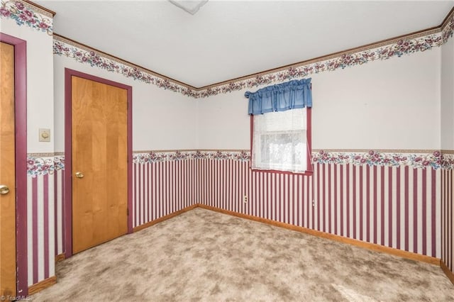 spare room with light colored carpet