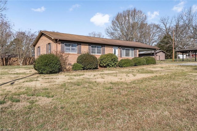 single story home featuring a front lawn