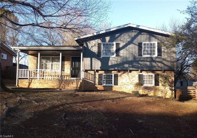 split level home featuring covered porch