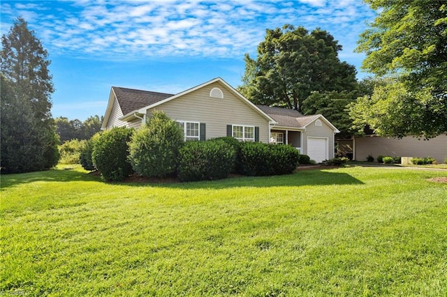 view of front facade with a garage and a front yard