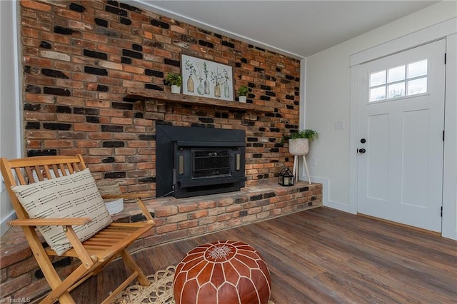 entrance foyer featuring baseboards and wood finished floors