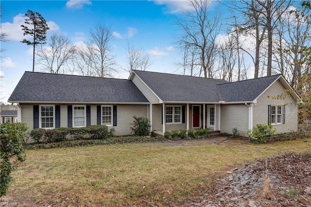 single story home with a front lawn