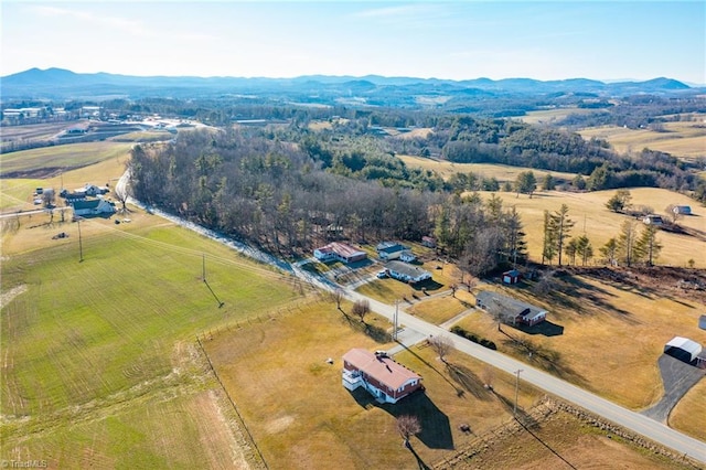 drone / aerial view featuring a rural view and a mountain view