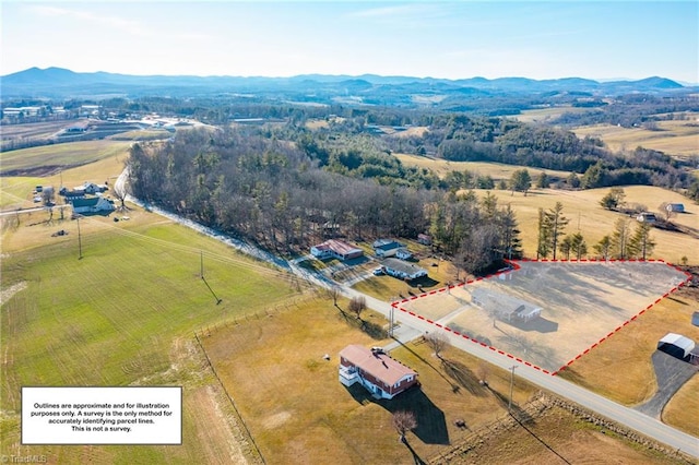 bird's eye view featuring a rural view and a mountain view