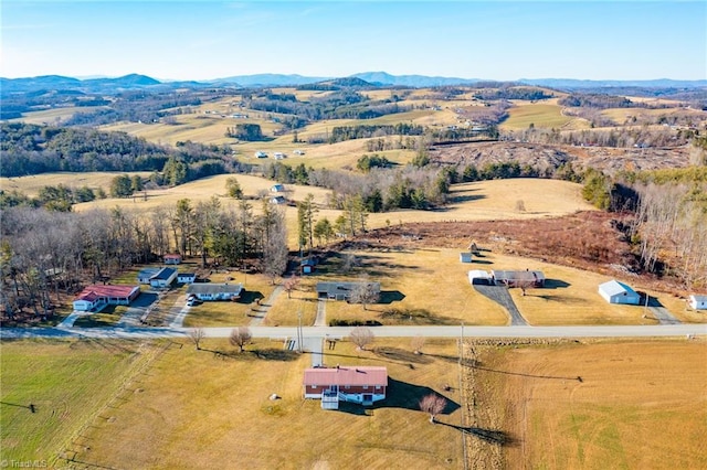 birds eye view of property featuring a mountain view and a rural view