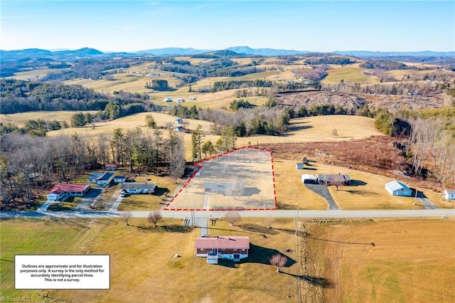 birds eye view of property featuring a rural view and a mountain view