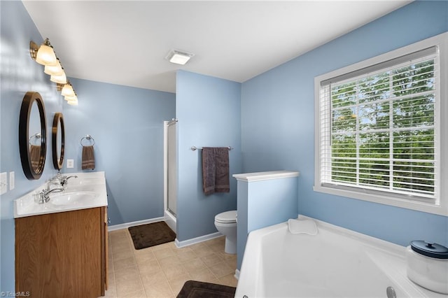bathroom featuring a washtub, toilet, a sink, baseboards, and visible vents