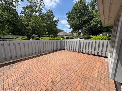 view of patio with fence