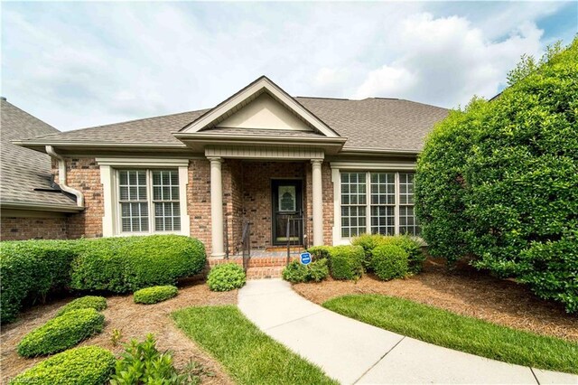 2334 Addison Blvd, High Point, NC 27262 - view of front facade with brick siding and a shingled roof