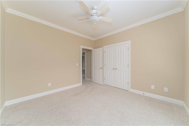 2334 Addison Blvd, High Point, NC 27262 - unfurnished bedroom with crown molding, baseboards, carpet flooring, a closet, and a ceiling fan