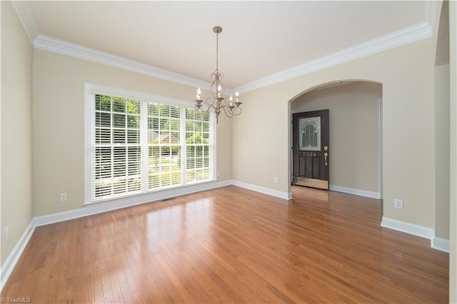 2334 Addison Blvd, High Point, NC 27262 - unfurnished room with arched walkways, a chandelier, ornamental molding, wood finished floors, and baseboards