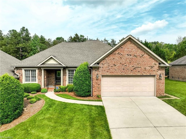 2334 Addison Blvd, High Point, NC 27262 - view of front facade with brick siding, a front lawn, concrete driveway, a garage, and a shingled roof