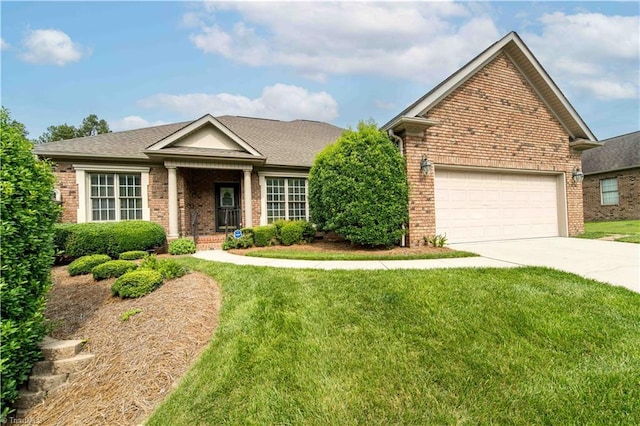 2334 Addison Blvd, High Point, NC 27262 - view of front of home featuring brick siding, driveway, and a front yard
