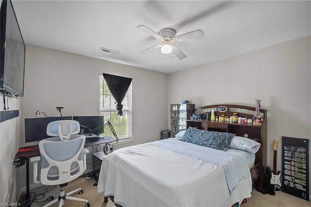 carpeted bedroom featuring ceiling fan and visible vents