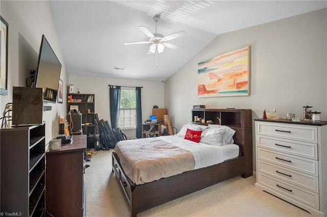 bedroom featuring ceiling fan, lofted ceiling, and light colored carpet
