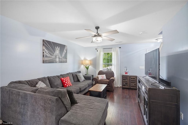 living area with ceiling fan and dark wood-style floors