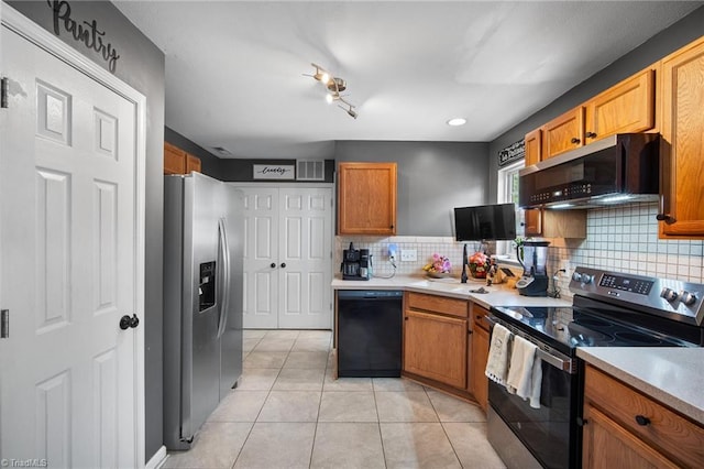 kitchen with visible vents, light countertops, tasteful backsplash, appliances with stainless steel finishes, and light tile patterned floors