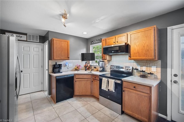 kitchen with visible vents, light countertops, tasteful backsplash, appliances with stainless steel finishes, and light tile patterned floors