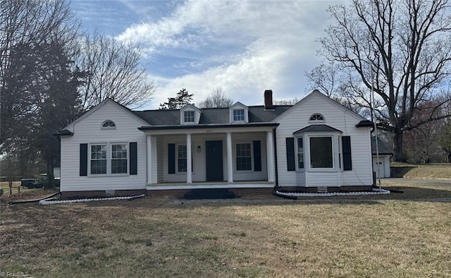 view of front facade featuring crawl space, covered porch, a chimney, and a front yard