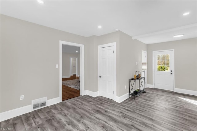 interior space with recessed lighting, visible vents, baseboards, and wood finished floors