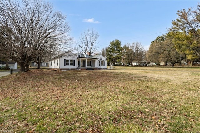 view of yard with covered porch