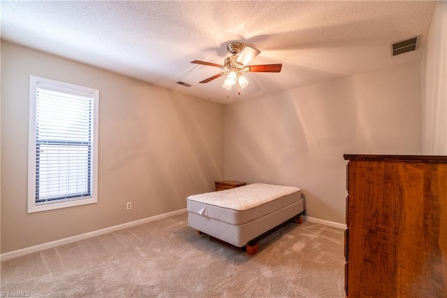 136 Fairway Dr, Bermuda Run, NC 27006 - bedroom with carpet flooring, a textured ceiling, and a ceiling fan