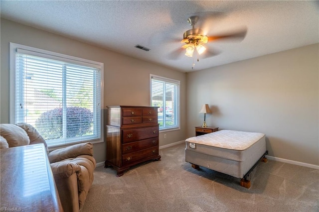 136 Fairway Dr, Bermuda Run, NC 27006 - bedroom with light colored carpet, ceiling fan, and a textured ceiling
