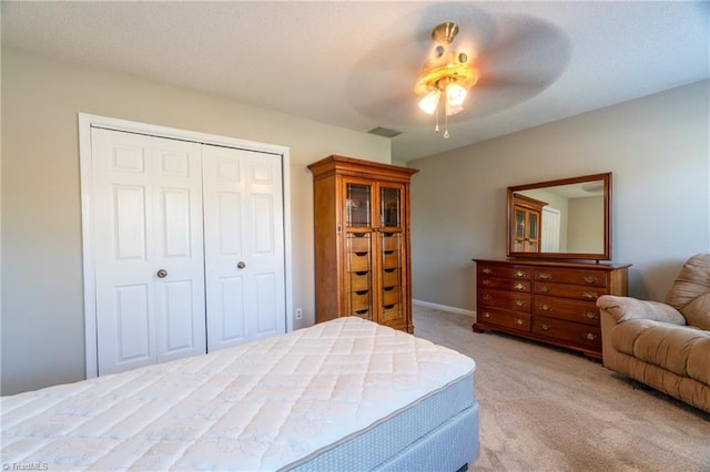 136 Fairway Dr, Bermuda Run, NC 27006 - bedroom featuring light carpet, a closet, and a ceiling fan