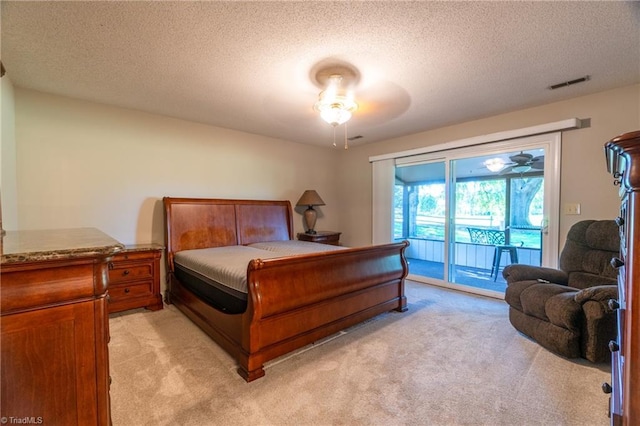 136 Fairway Dr, Bermuda Run, NC 27006 - bedroom with light carpet, access to outside, and a textured ceiling